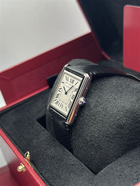 cartier tank must preowned.